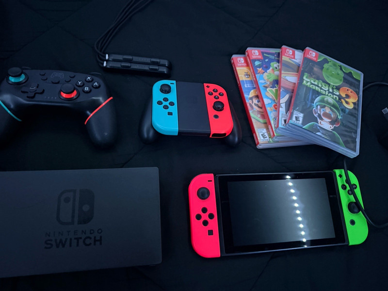 Nintendo Switch Console Neon Red & Green Joy-Con, Pro Controller, Case, 4 Games