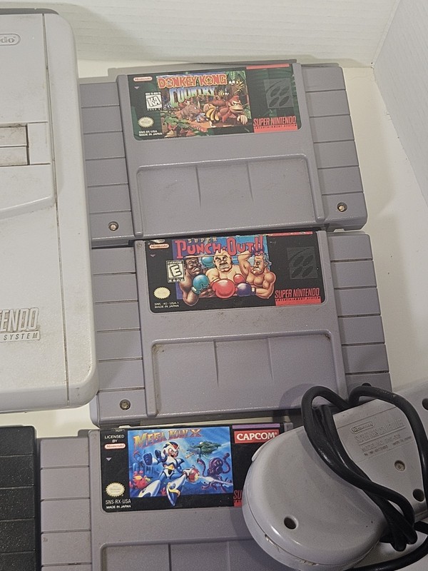 Super Nintendo SNES JR Console with 8 games, cords, and 1 controller gallery