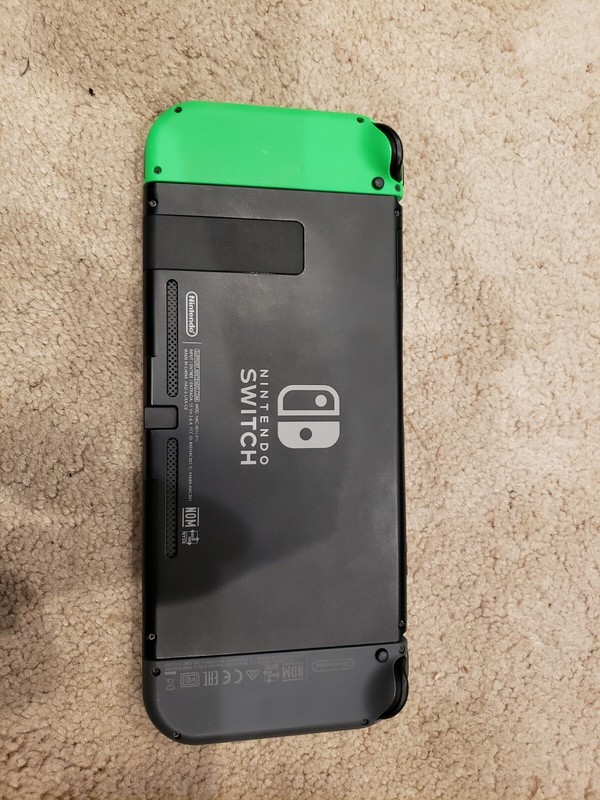 Nintendo Switch with soft, hard, and carrying case - green and black joycons gallery