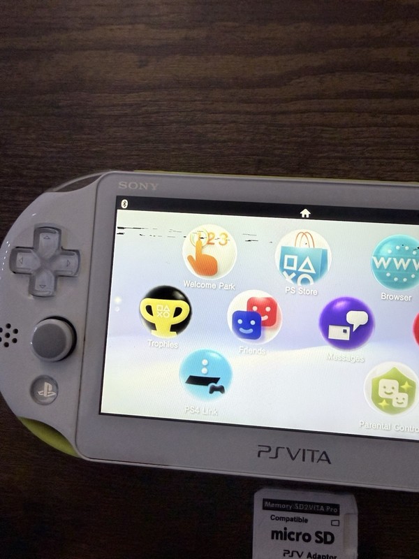 Sony PS Vita 2000 Handheld Console White/Yellow with Wi-Fi micro SD Adapter gallery