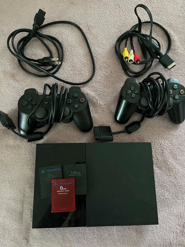 Sony PS2 Slim (w/ cords, two controllers, 4 memory cards) – Tested and working