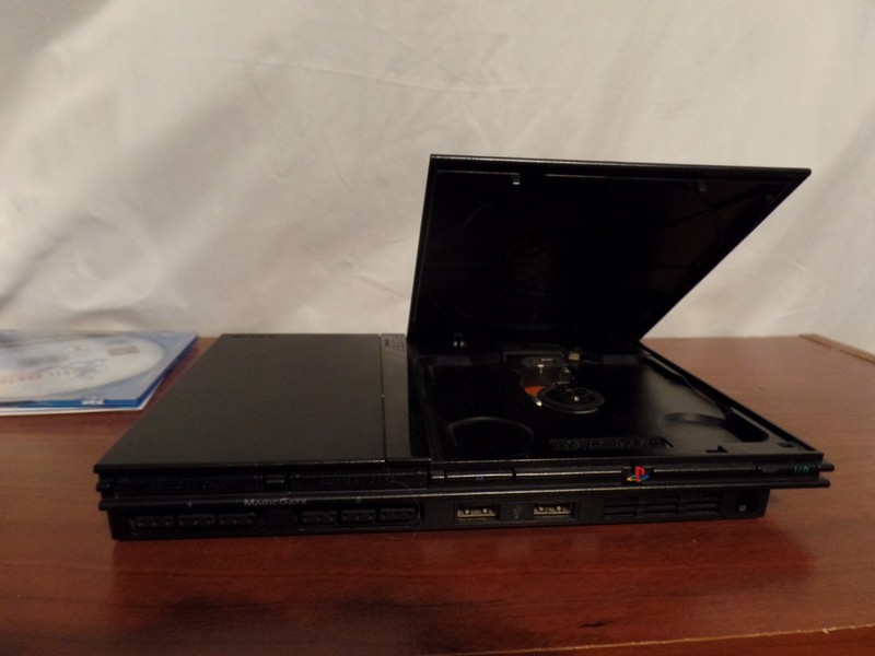 Sony PlayStation 2 Black Console W/ 2 Controllers. Memory Card, and Games gallery