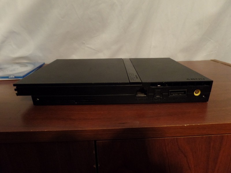Sony PlayStation 2 Black Console W/ 2 Controllers. Memory Card, and Games gallery