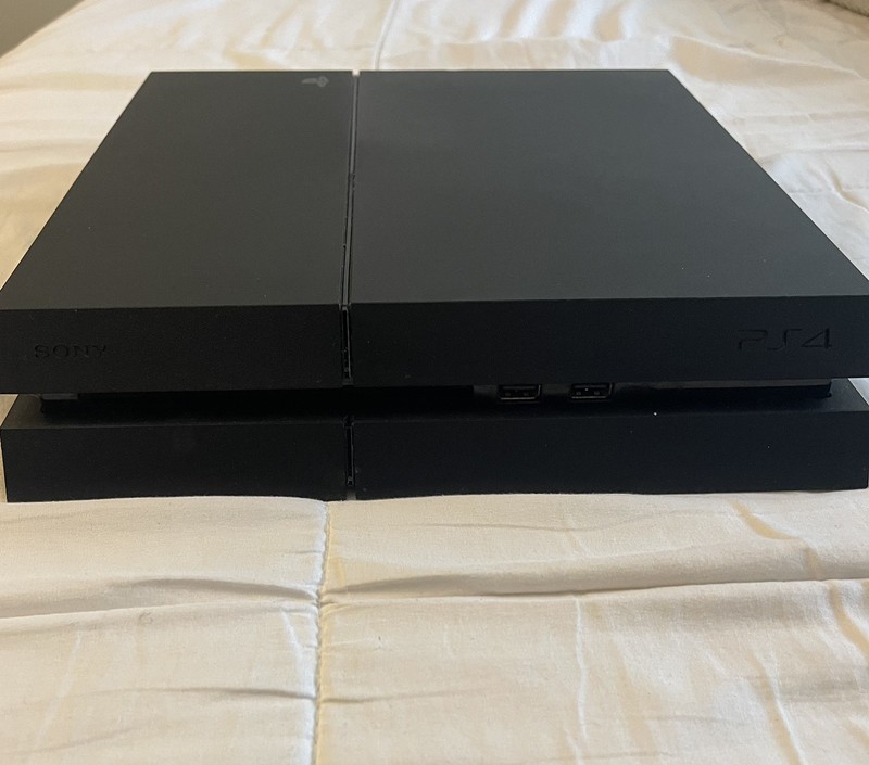 Working PS4 500GB console, w/power cord, PS4 controller, and 5 PS4 games
